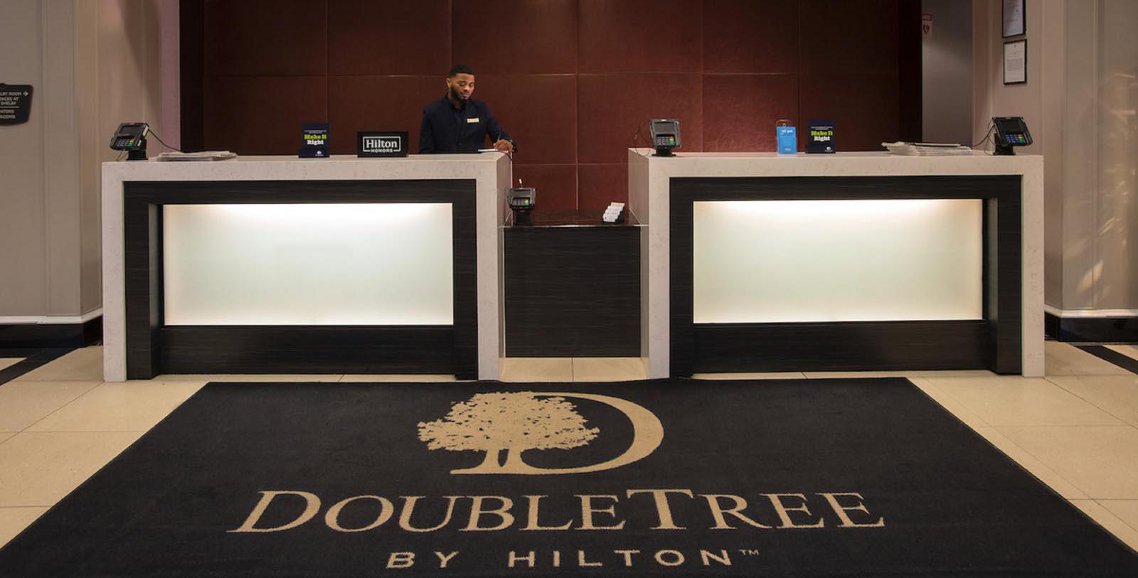 Image of Front desk in hotel lobby at DoubleTree Suites by Hilton Hotel Detroit Downtown - Fort Shelby, 1917, Member of Historic Hotels of America, in Detroit, Michigan, Special Offers, Discounted Rates, Families, Romantic Escape, Honeymoons, Anniversaries, Reunions