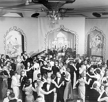 Historical image of guests dancing in the Grand Ballroom at Historic Americus Hotel.