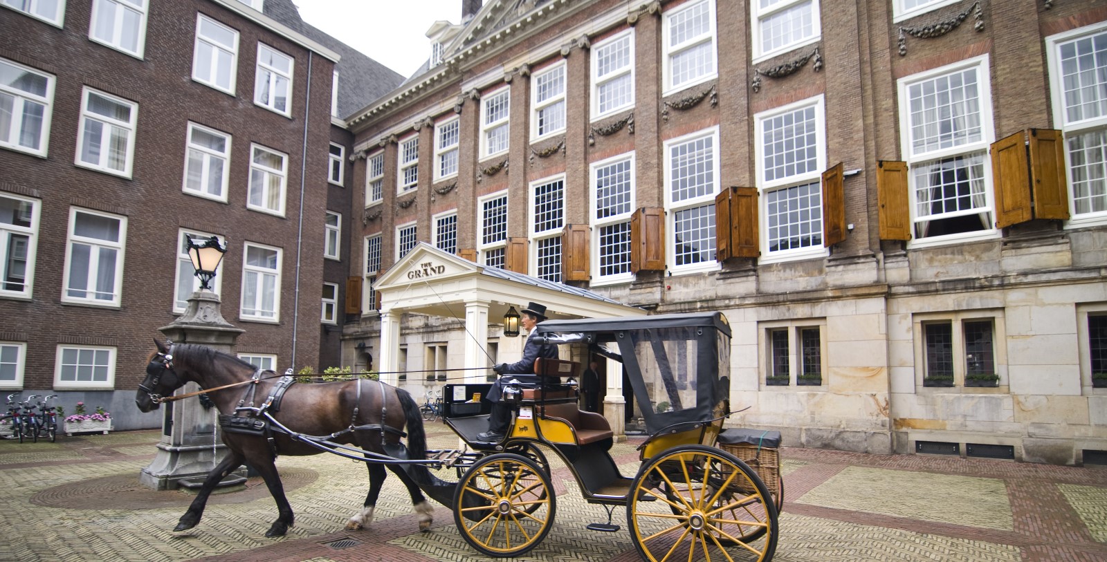 Explore the Royal Palace Amsterdam and the De Nieuwe Kerk just moments away.