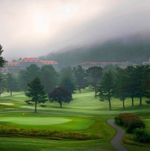 Image of Golf Course with Exterior in Background, Omni Grove Park Inn, 1913, Member of Historic Hotels of America, in Asheville, North Carolina.