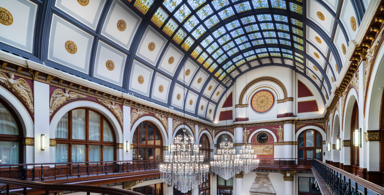Image of an arched coffered ceiling with ornamentation and chandeliers at The Union Station Nashville Yards, a member of Historic Hotels of America since 2015, located in Nashville, Tennessee