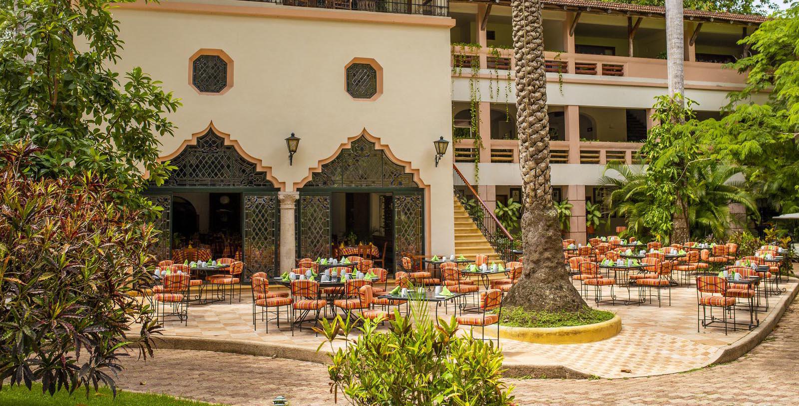 Image of Outdoor Dining Area with Palm Trees Mayaland Hotel & Bungalows,1923, Member of Historic Hotels Worldwide, in Chichen Itza, Mexico, Experience