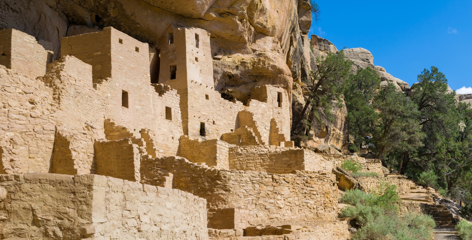 Experience walking through the cliff dwellings at Mesa Verde National Park, some of the best-preserved archaeological treasures in North America.