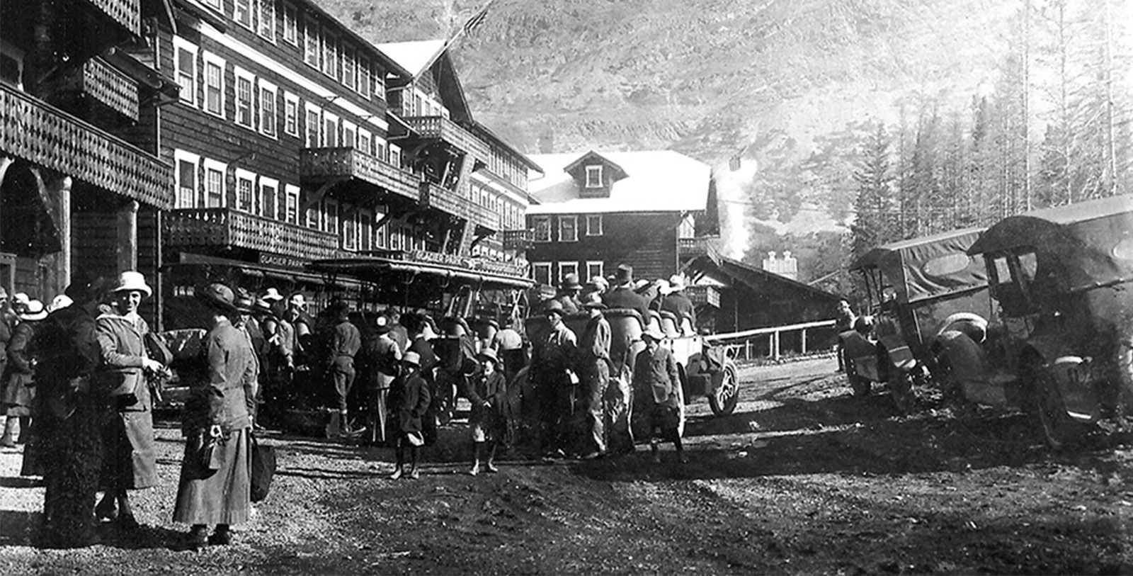 Historical Image of Guests Standing Outside Hotel, Many Glacier Hotel, 1915, Member of Historic Hotels of America, in Babb, Montana., History