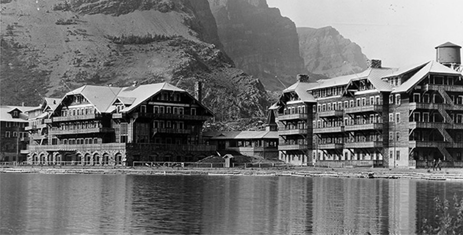 Discover the style of architecture known as National Park Service Rustic that defines the appearance of the Many Glacier Hotel.