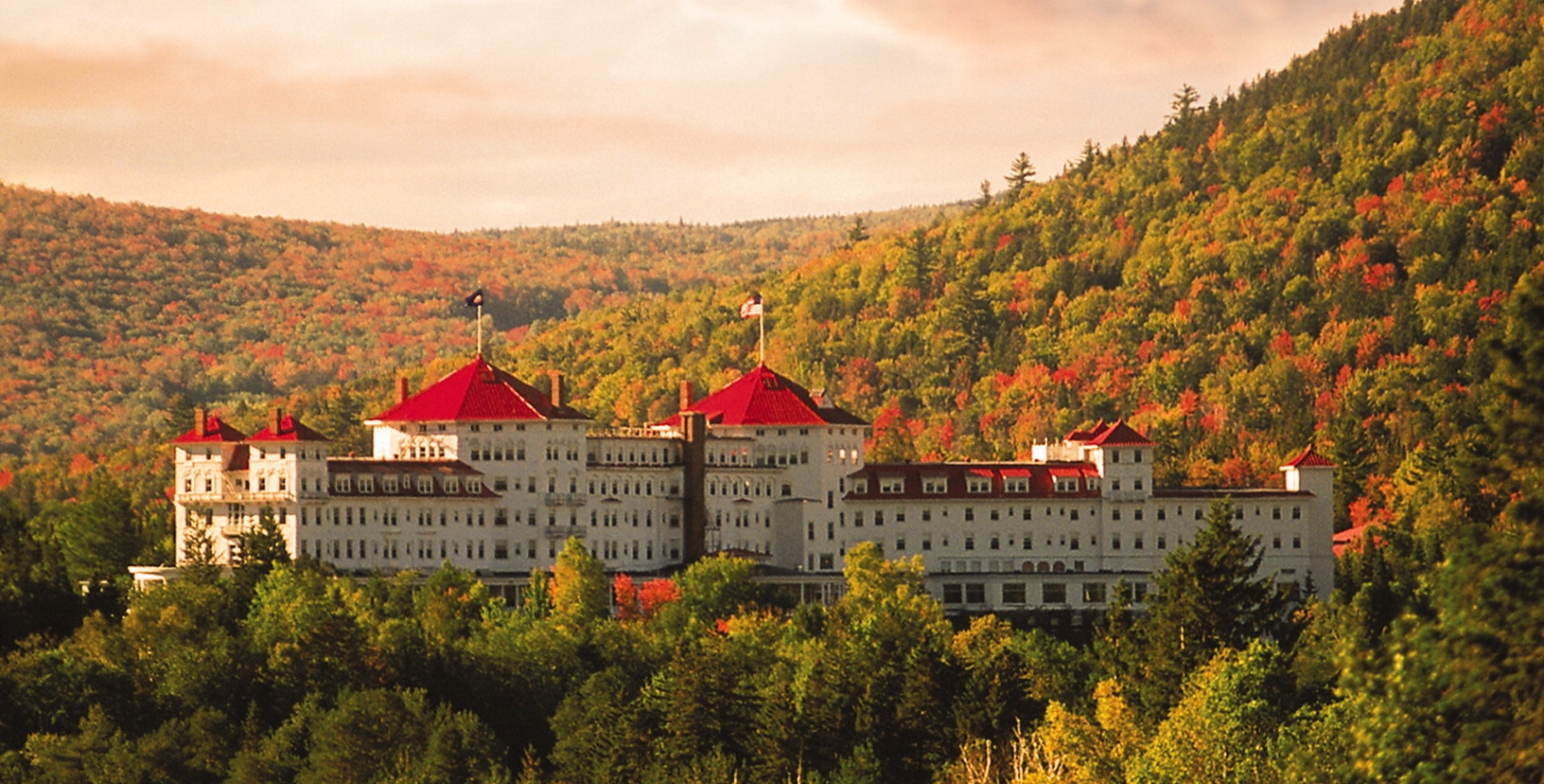 Discover the the sparkling white and red-roofed Spanish Renaissance-style façade of the Omni Mount Washington, an Italian craftsmen constructed masterpiece and historical epicenter.