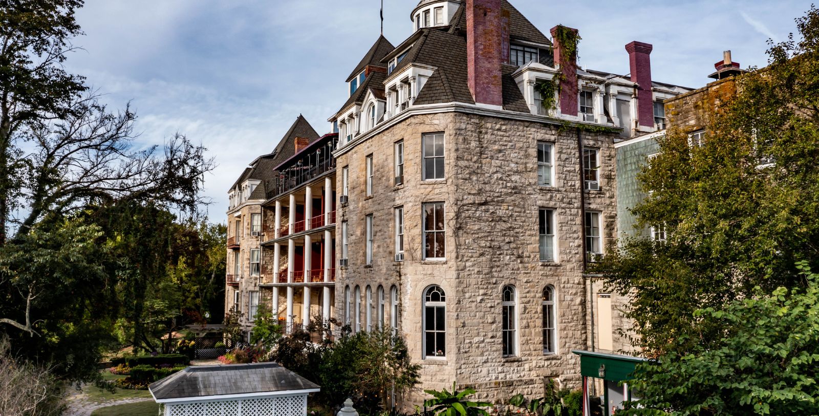 Image of Wedding Couple Outside 1886 Crescent Hotel & Spa, Member of Historic Hotels of America, in Eureka Springs, Arkansas, Experience