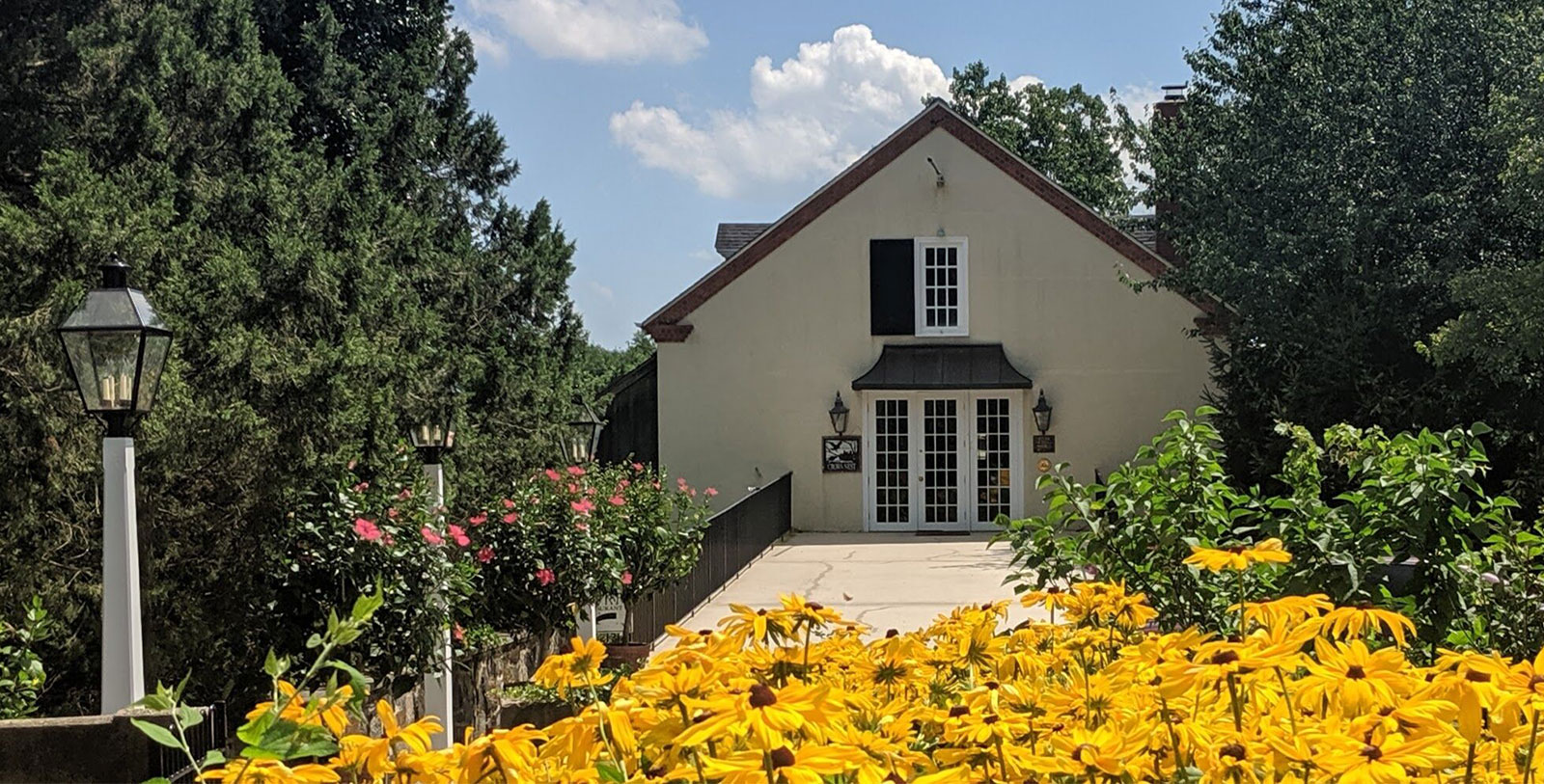 Image of Exterior with Yellow Flowers The Inn at Montchanin Village, 1799, Member of Historic Hotels of America, in Montchanin, Delaware, History