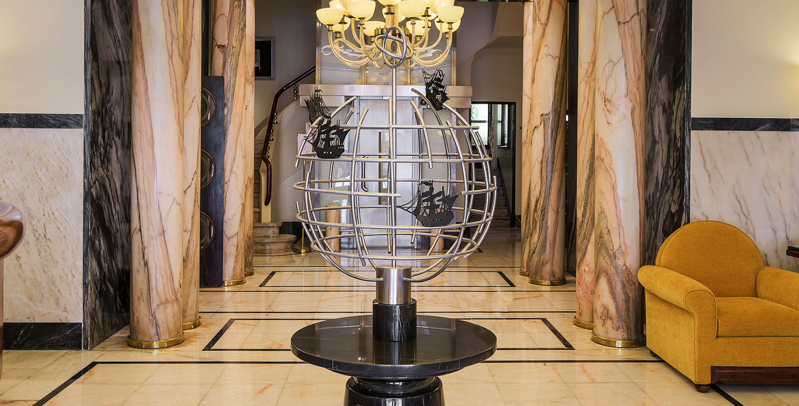 Image of armillary sphere in the lobby of Hotel Britania Art Deco, 1944, a member of Historic Hotels Worldwide in Lisbon, Portugal, Special Offers, Discounted Rates, Families, Romantic Escape, Honeymoons, Anniversaries, Reunions