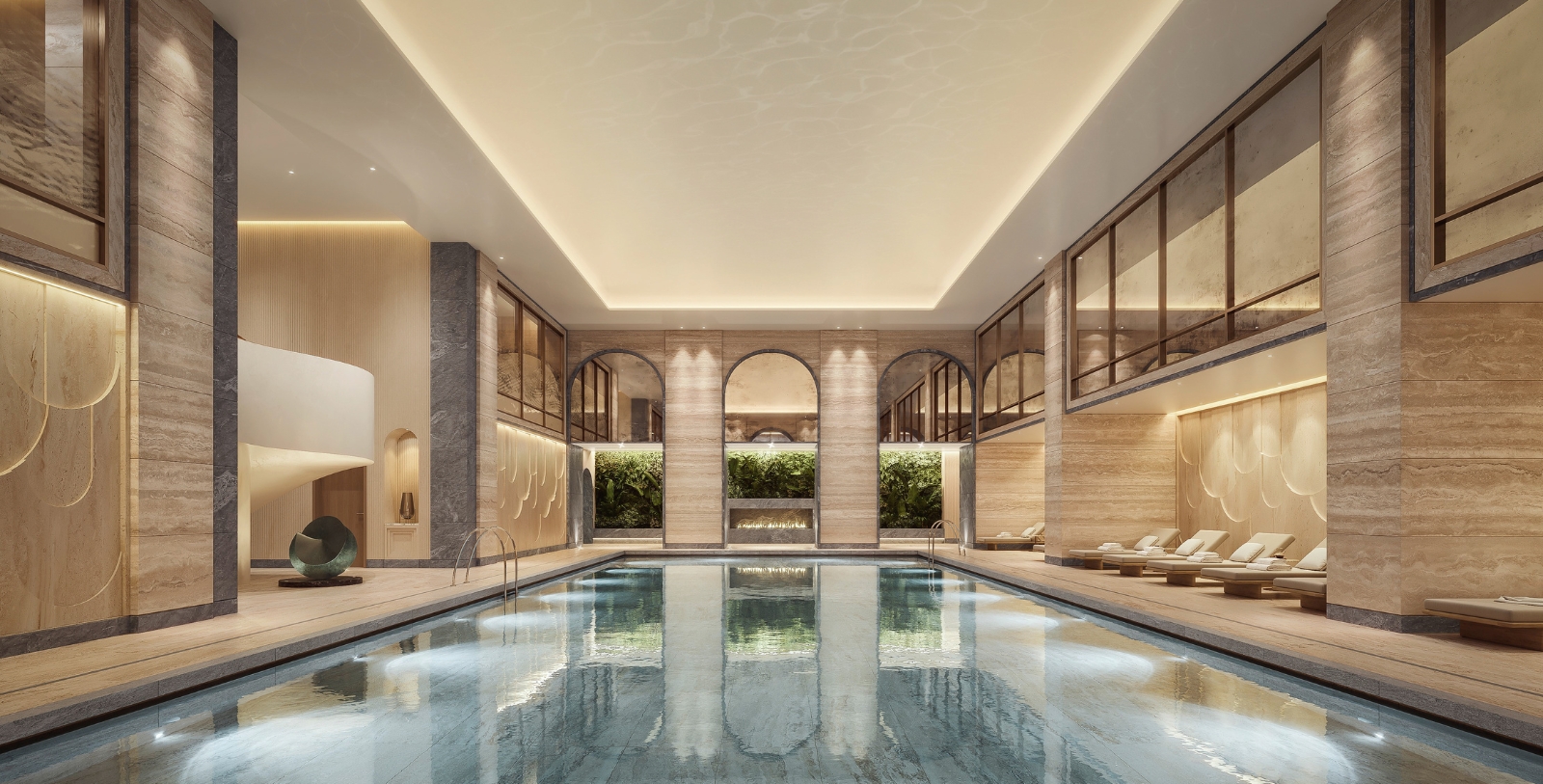 Image of the indoor swimming pool with loungers on the deck. Raffles London at The OWO, a member of Historic Hotels Worldwide since 2023, located in London, United Kingdom