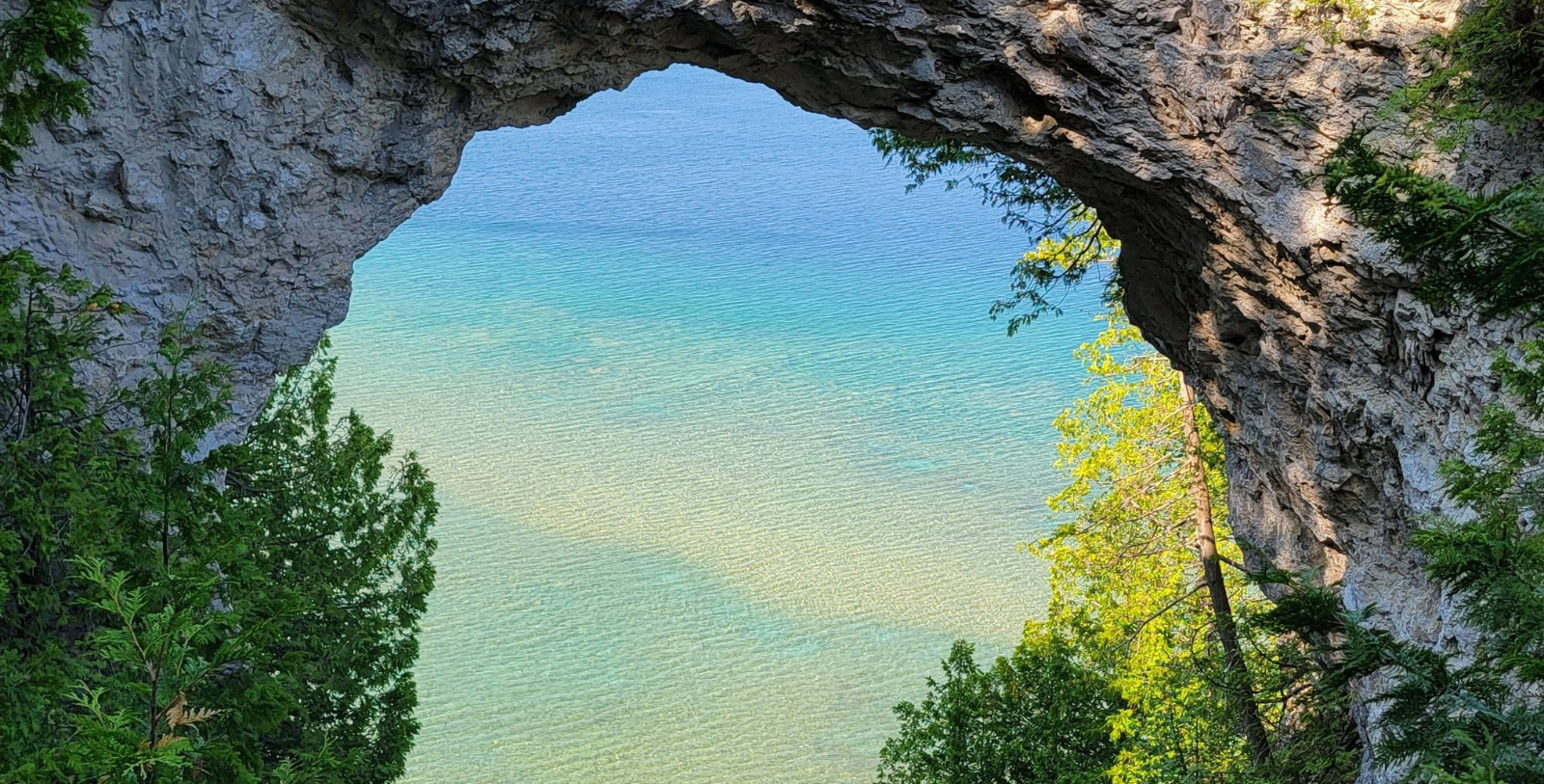 Explore ancient rock formations on Mackinac Island at Arch Rock.