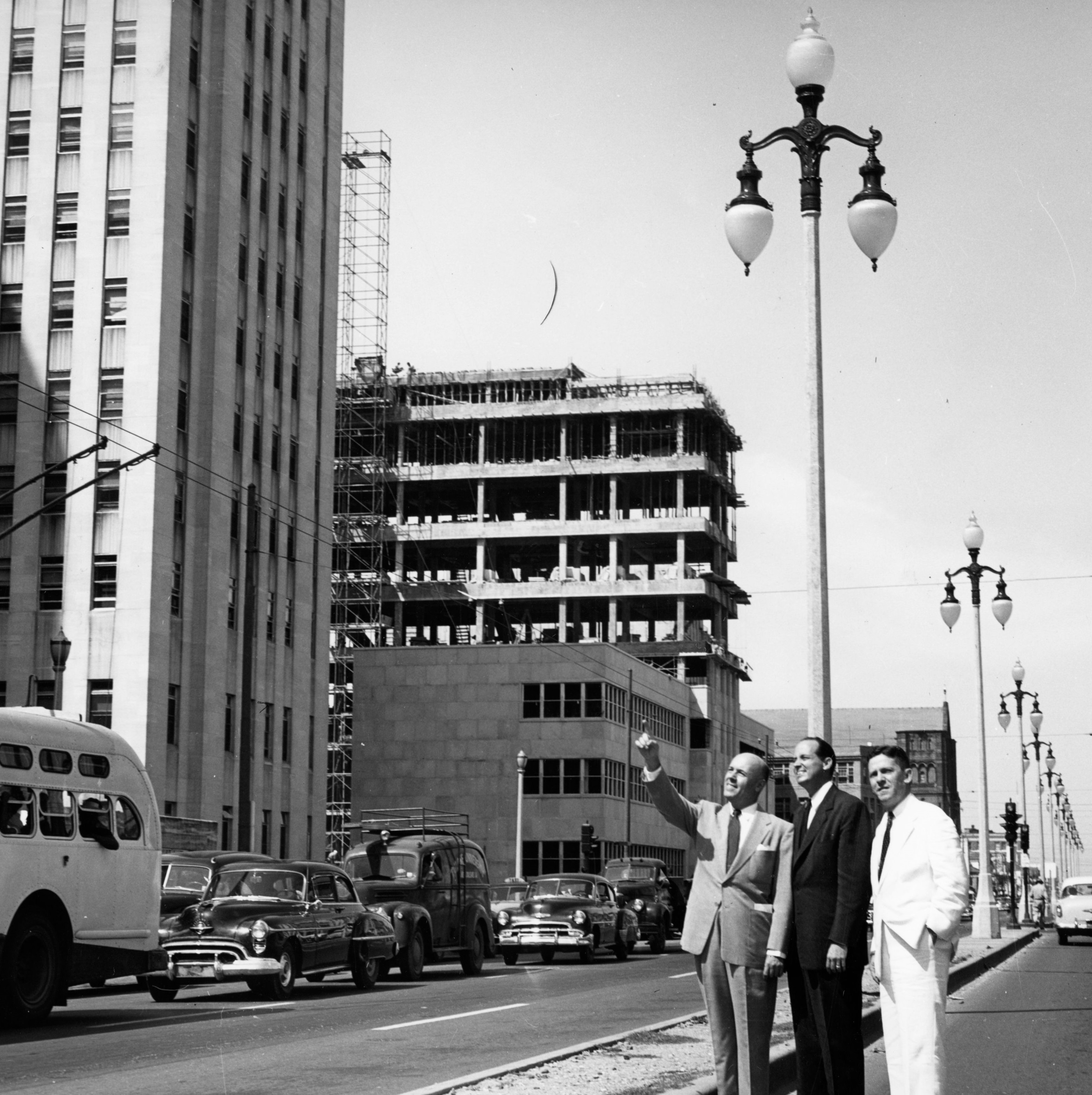 Historical Image of Exterior with Three Men in Foreground, NOPSI New Orleans, 1927, Member of Historic Hotels of America, in New Orleans, Louisiana.