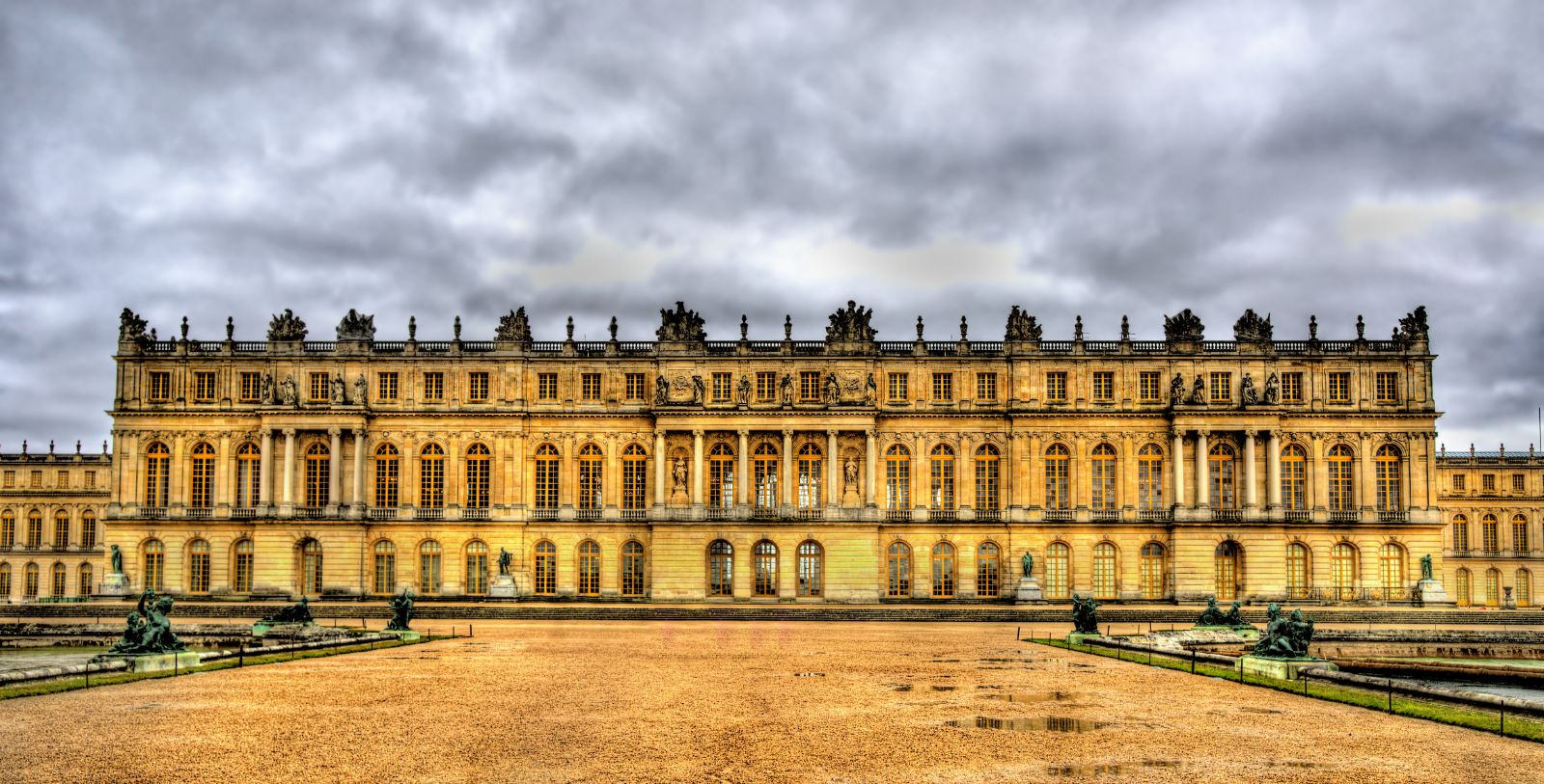 Explore the Palace of Versailles and its expansive gardens.