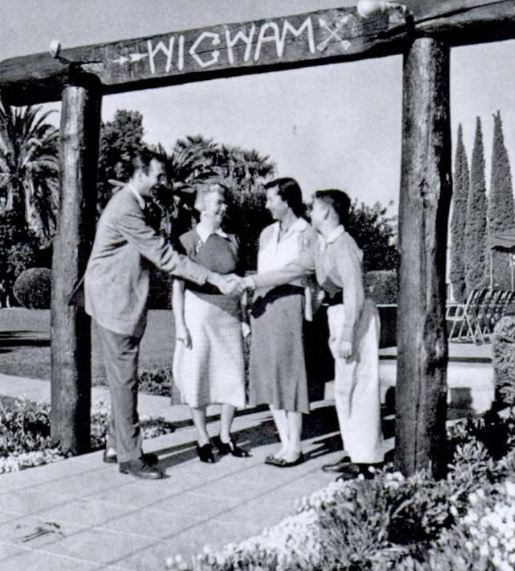 Historical Image of General Manager Reade Whitwell Shaking Hands, The Wigwam, 1929, Member of Historic Hotels of America, in Litchfield Park, Arizona.