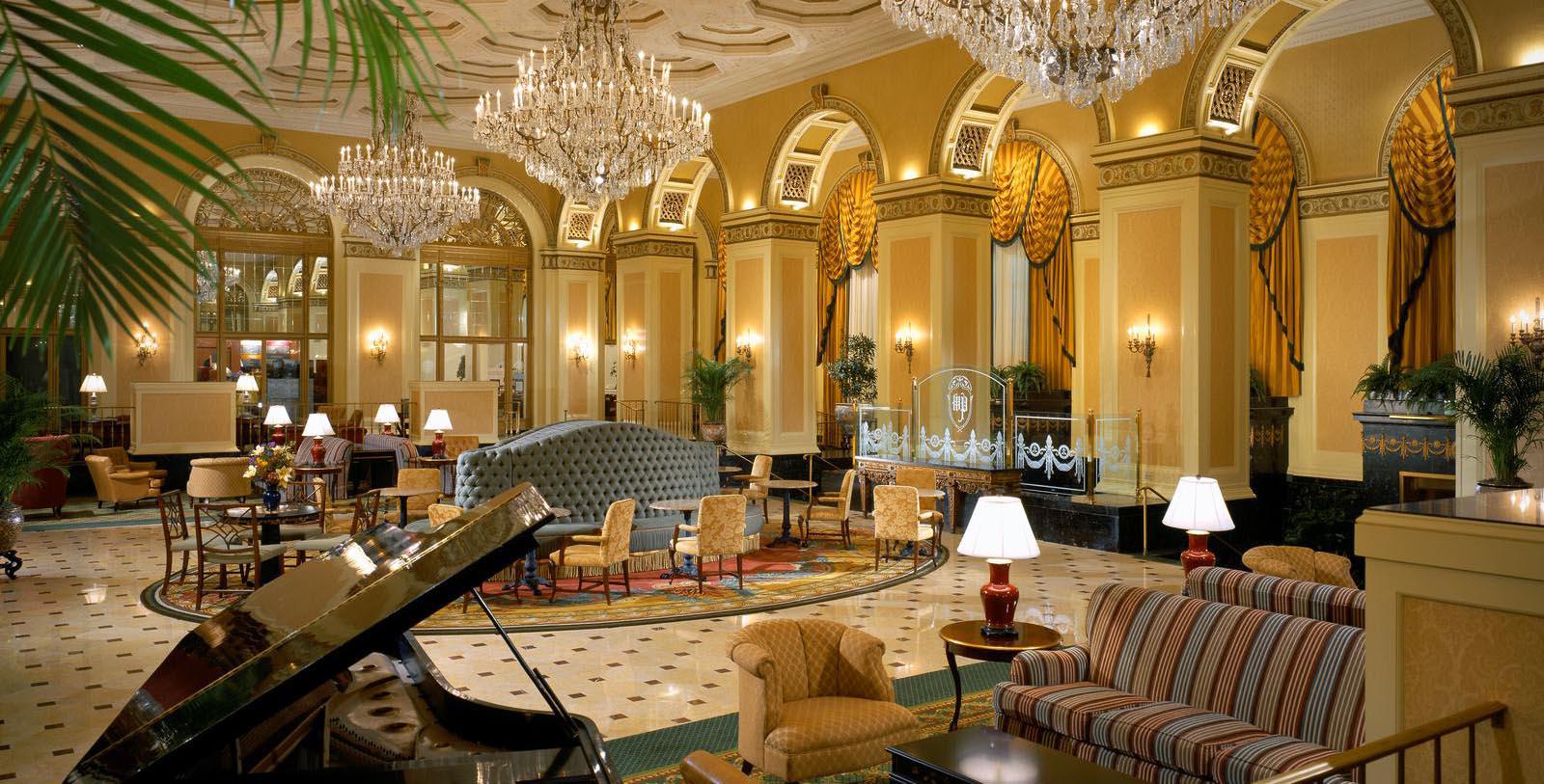 Interior lobby with chandeliers and piano of the Omni William Penn Hotel, Pittsburgh, Pennsylvania.