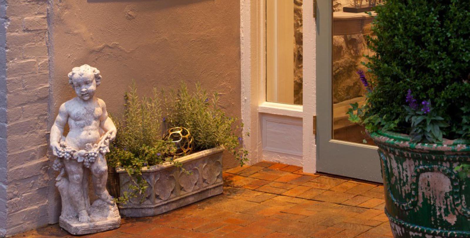 Image of Statue with Small Garden The Georges, 1789, Member of Historic Hotels of America, in Lexington, Virginia, Discover