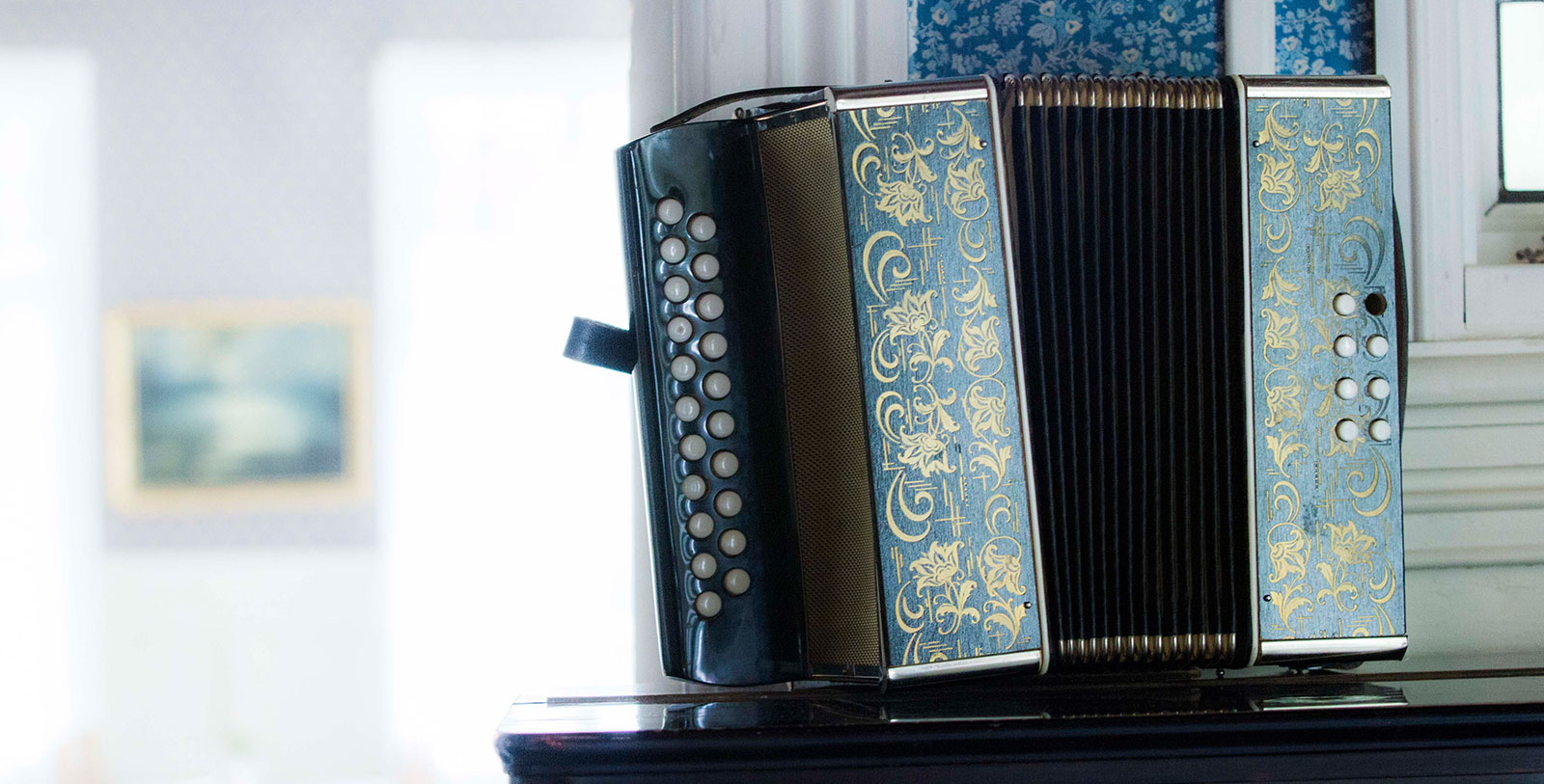 Image of antique accordion at Visnes Hotel Stryn, 1850, a member of Historic Hotels Worldwide in Stryn, Norway