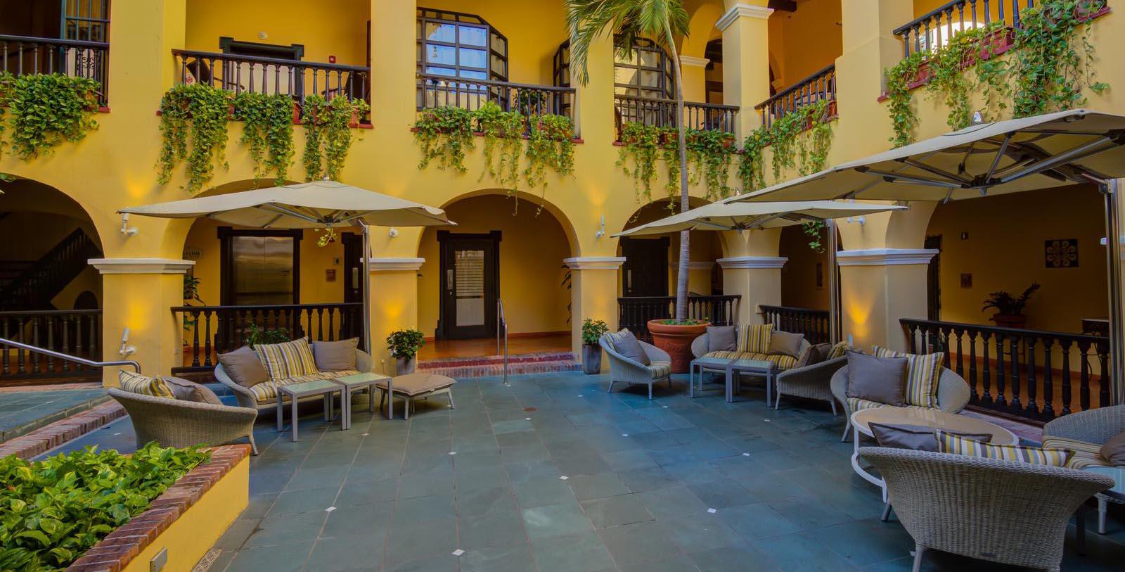 Image of hotel exterior courtyard at El Convento Hotel, 1948, Member of Historic Hotels of America, in San Juan, Puerto Rico, Special Offers, Discounted Rates, Families, Romantic Escape, Honeymoons, Anniversaries, Reunions