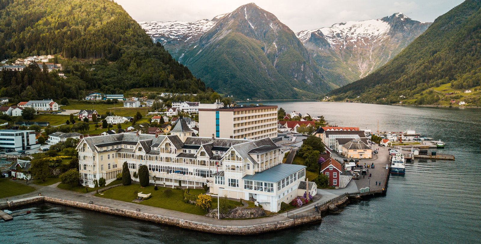 Image of Hotel Exterior with Historic Car Kviknes Hotel, 1752, Member of Historic Hotels Worldwide, in Balestrand, Norway, Special Offers, Discounted Rates, Families, Romantic Escape, Honeymoons, Anniversaries, Reunions