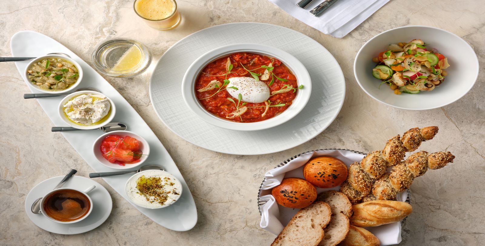 Taste a brunch specialty, Shakshuka, a rich and spicy stew with poached eggs.