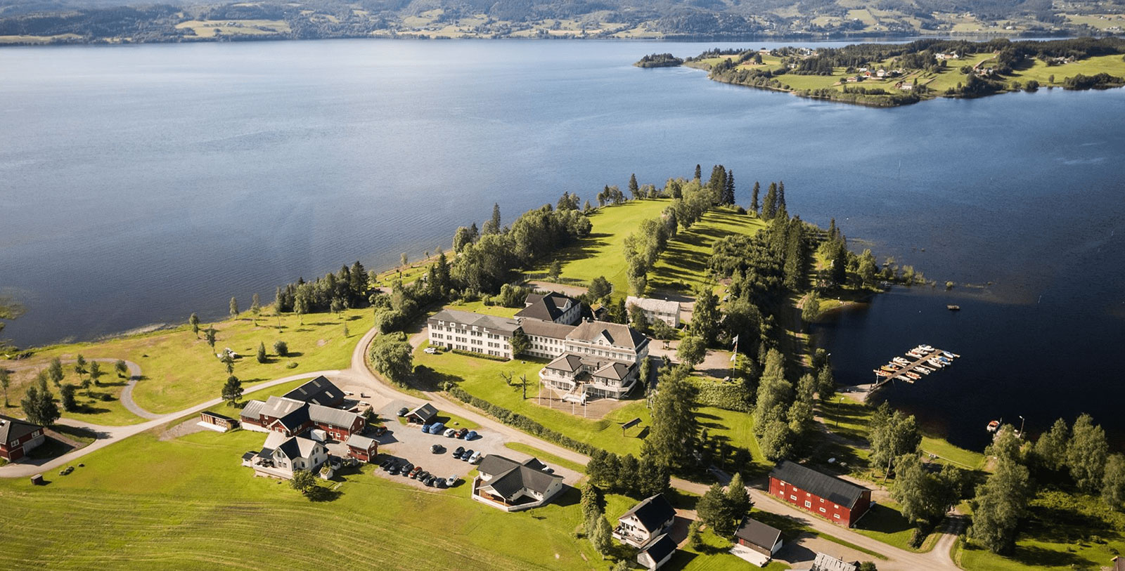 Image of Hotel Exterior and Surrounding Lake, Selbusjoen Hotel & Gjestegard, 1850, Member of Historic Hotels Worldwide, in Selbu, Norway, Experience