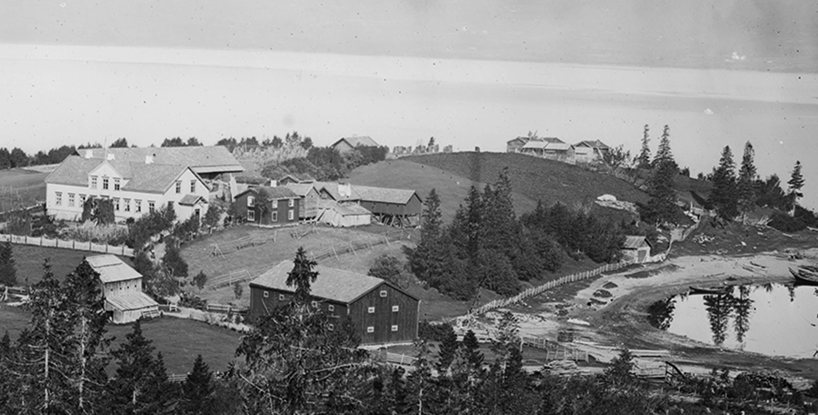 Historic Image of Hotel Exterior and Lake at Selbusjoen Hotel & Gjestegard, 1850, Member of Historic Hotels Worldwide, in Selbu, Norway, Discover