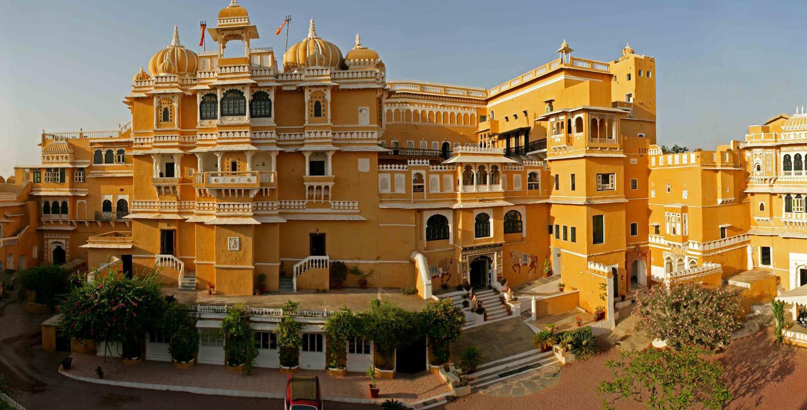 Image of camel pulling people on a cart Deogarh Mahal, 1670, Member of Historic Hotels Worldwide, in Deogarh, India, Explore