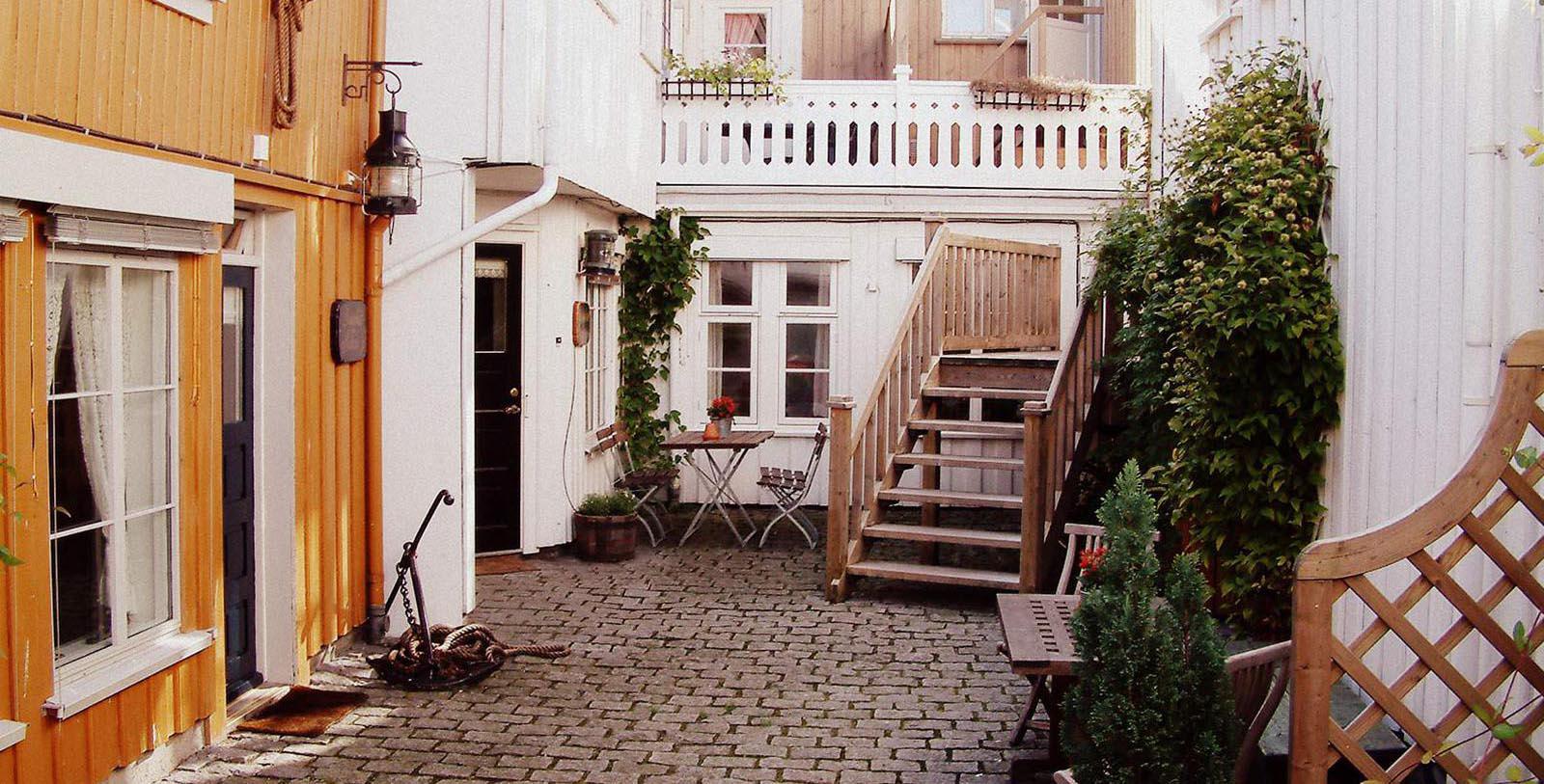 Image of courtyard area outside Det Lille Hotel, 1750, Member of Historic Hotels Worldwide, Risør, Norway, Special Offers, Discounted Rates, Families, Romantic Escape, Honeymoons, Anniversaries, Reunions