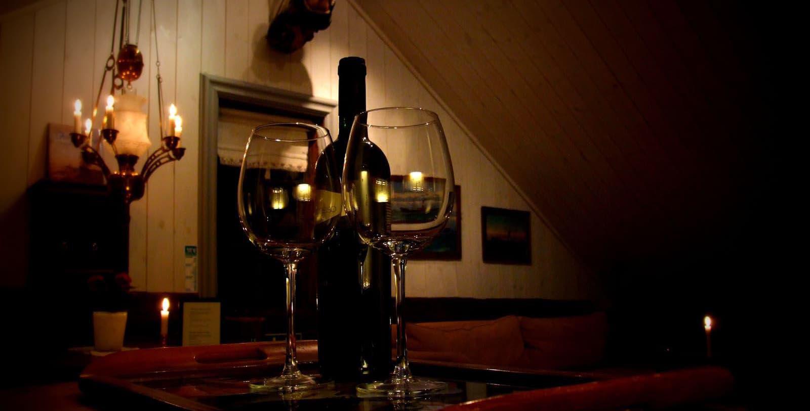 Image of bottle of wine and glasses Det Lille Hotel, 1750, Member of Historic Hotels Worldwide, Risør, Norway, Taste