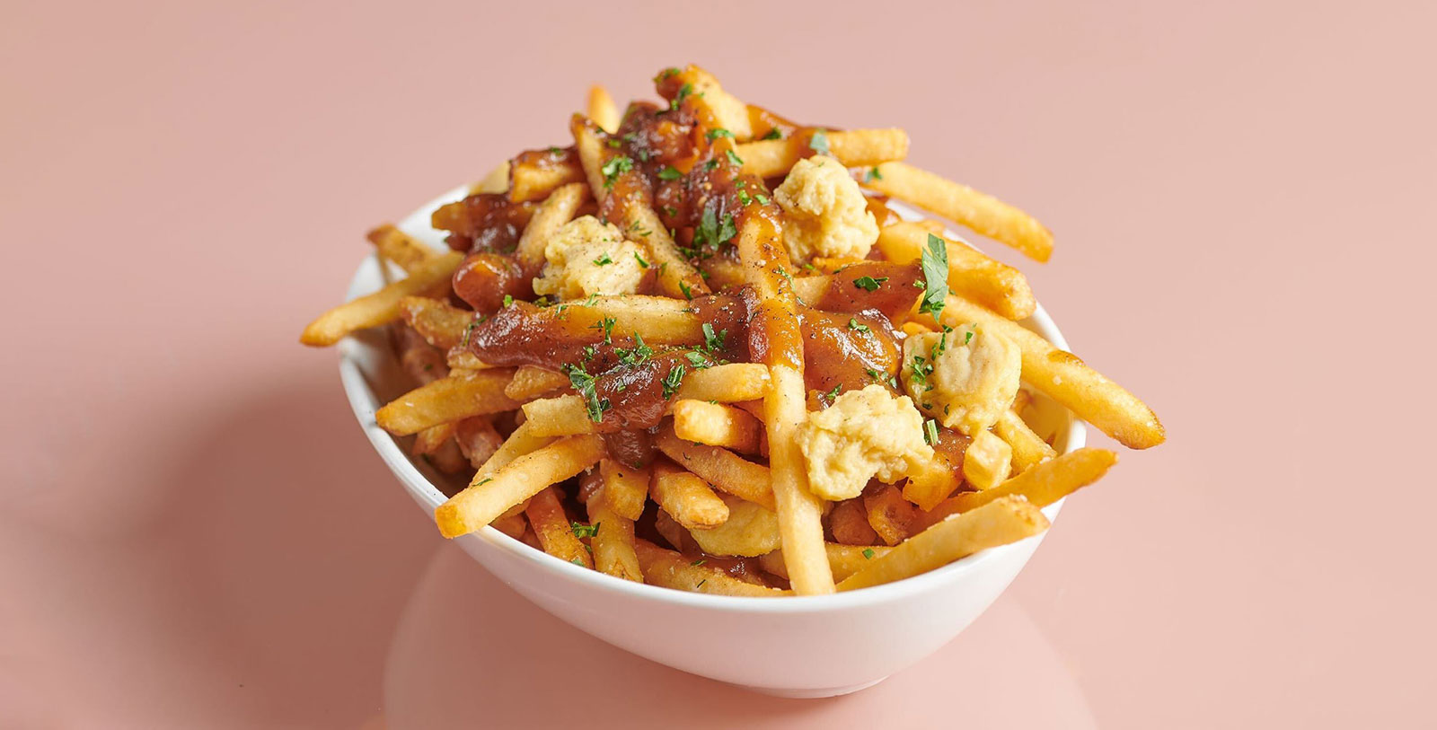 Image of Belmont Poutine served at The Living Room, Hotel Belmont Vancouver MGallery, 1911, a Member of Historic Hotels Worldwide in Vancouver, British Columbia, Canada, Taste