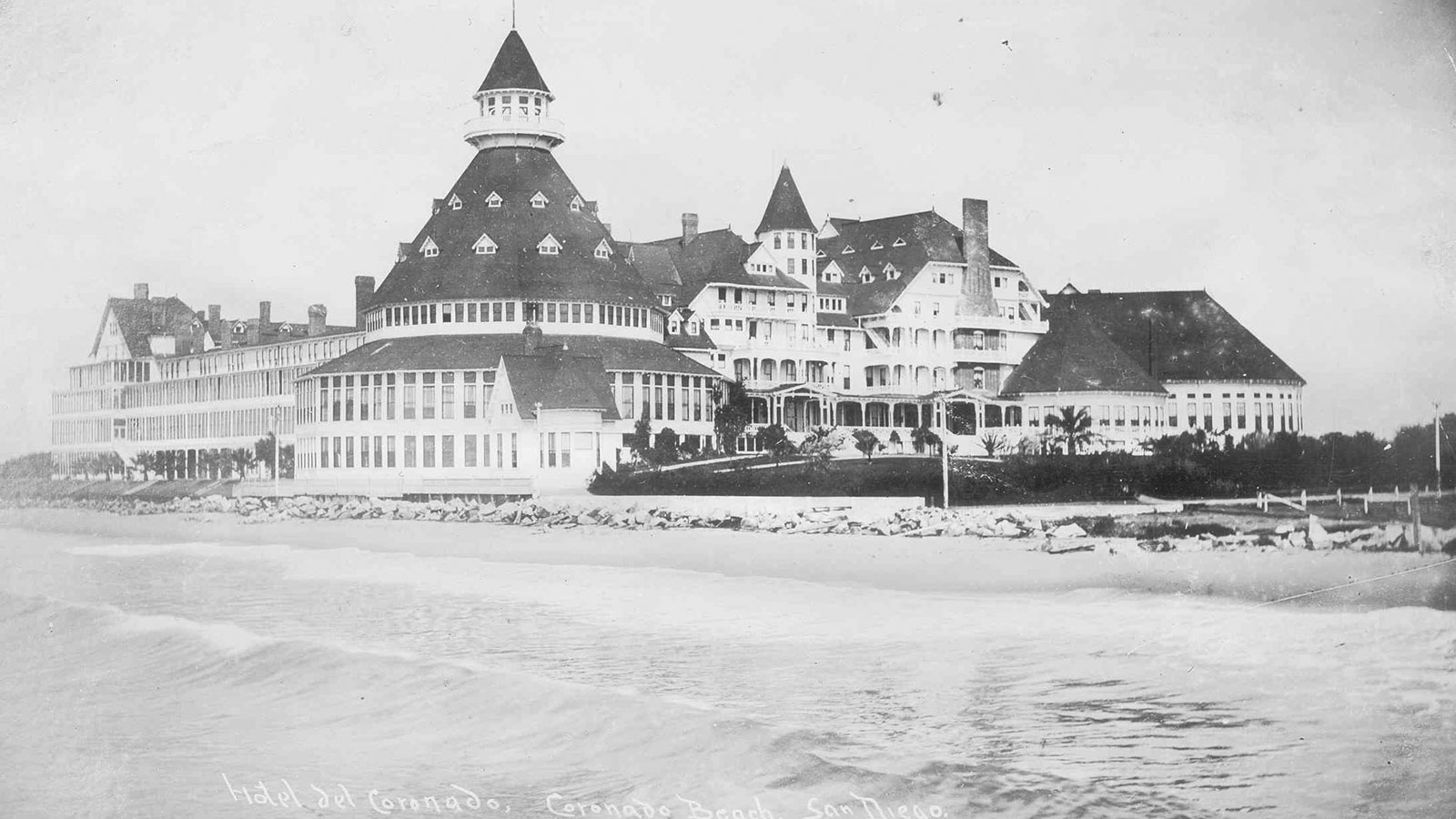 Image of the ocean and of the Hotel Del Coronado, Curio Collection by Hilton